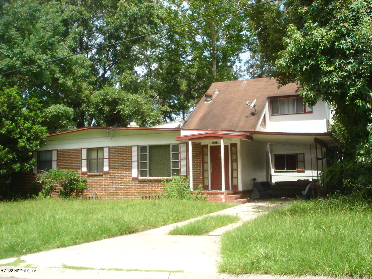 3133 Ray Road Jacksonville, FL 32209 - Photo 1 of 1 a view of a house with a yard and potted plants