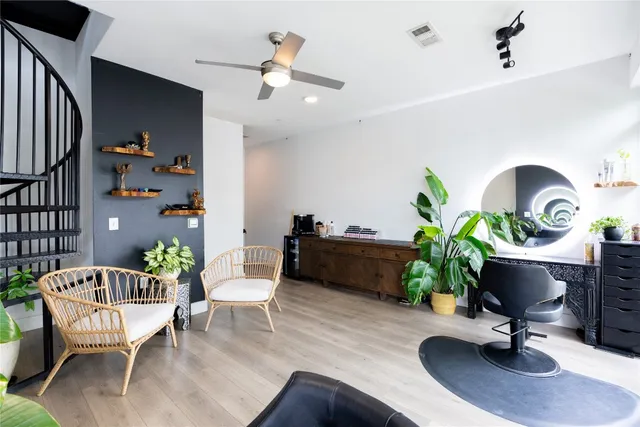 a workspace with furniture and a potted plant