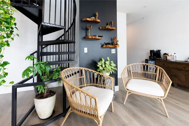 a view of a chair and table in the balcony