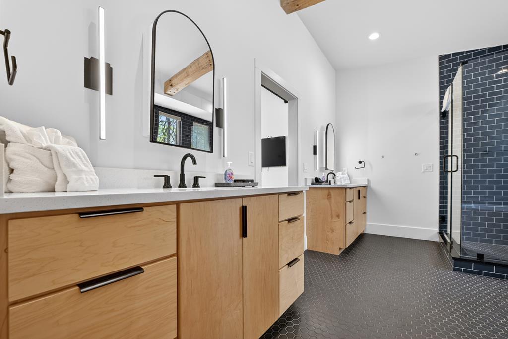 315 Blue Berry Ridge Morganton, GA 30560 - Photo 27 of 61 a spacious bathroom with a double vanity sink and mirror