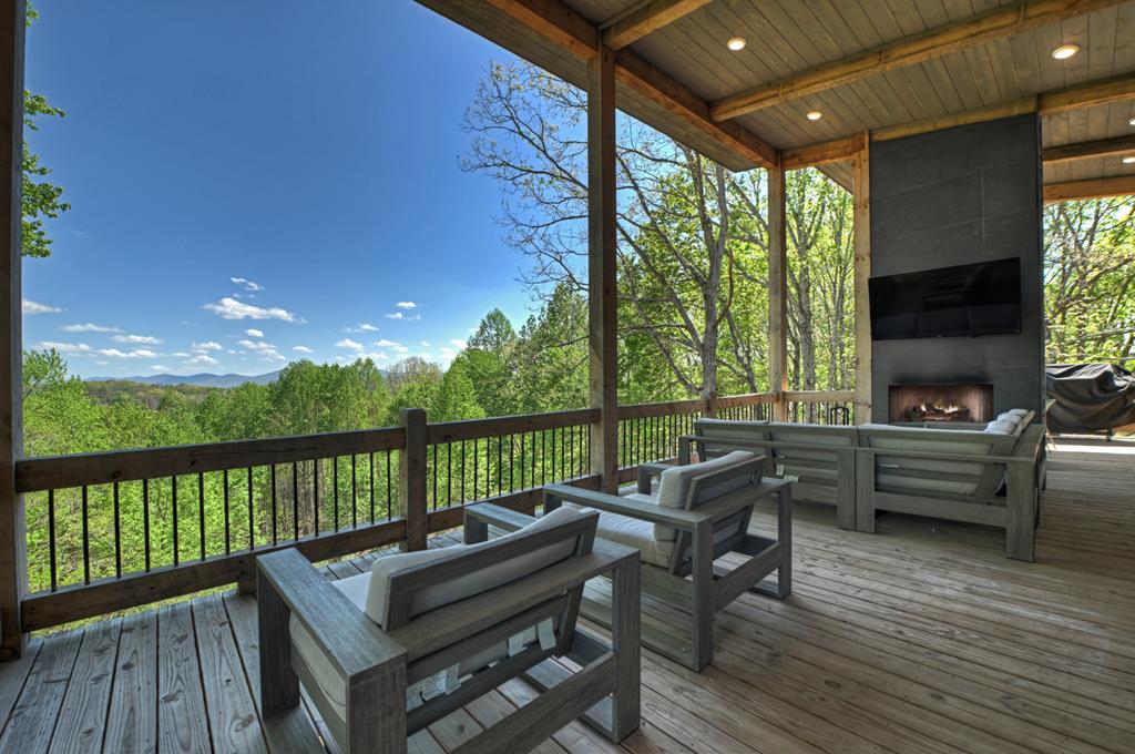 315 Blue Berry Ridge Morganton, GA 30560 - Photo 32 of 61 a balcony with wooden floor and outdoor seating