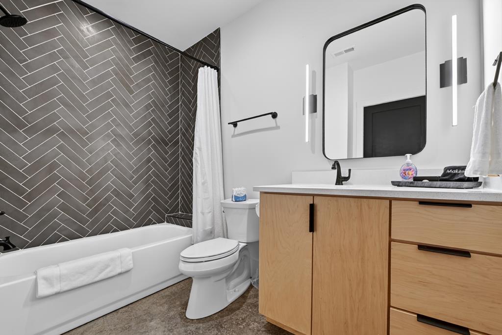 315 Blue Berry Ridge Morganton, GA 30560 - Photo 46 of 61 a bathroom with a sink toilet and shower