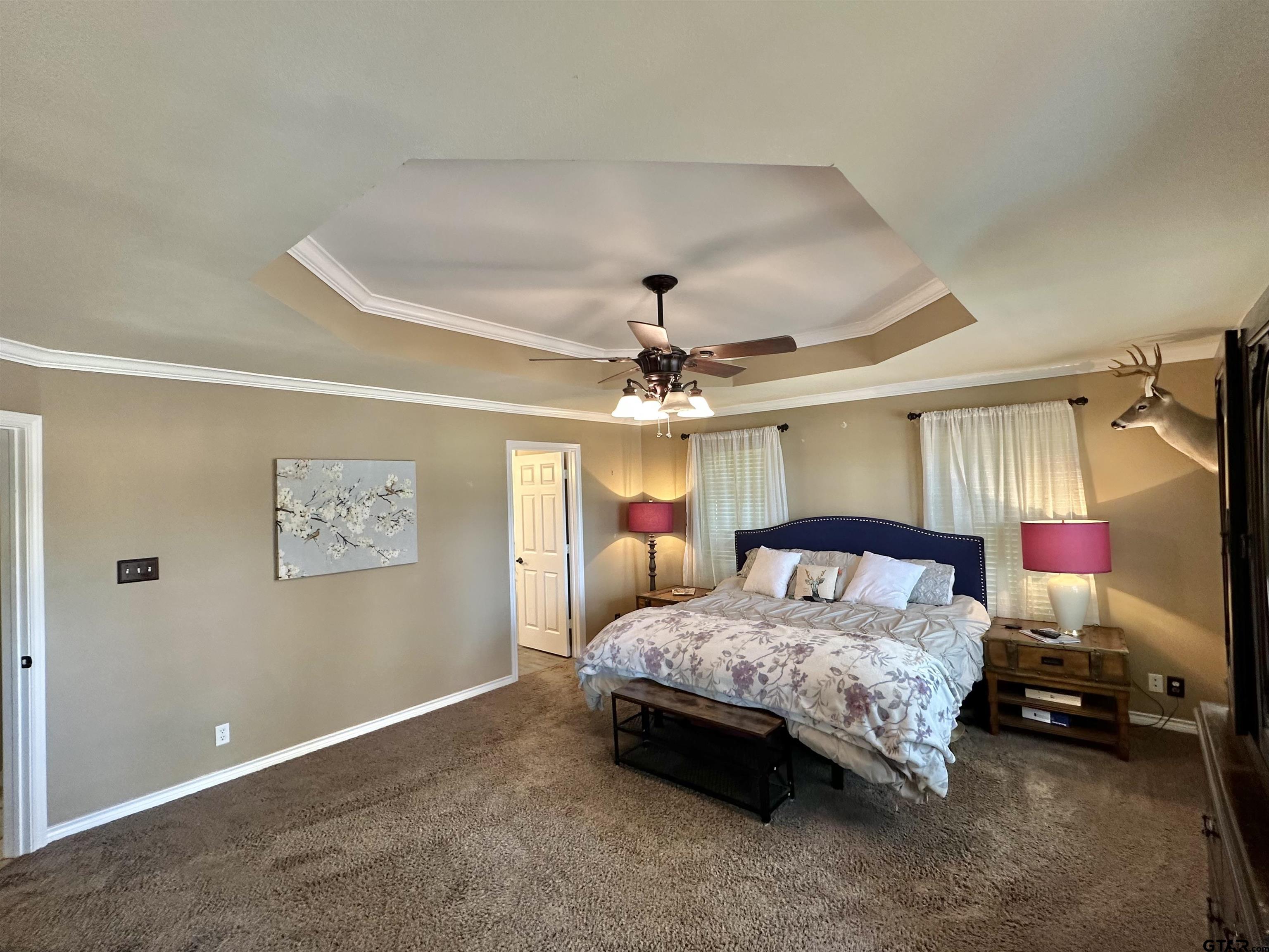 13449 South Hillcreek Road Whitehouse, TX 75791 - Photo 19 of 41 a bedroom with a bed and a chandelier