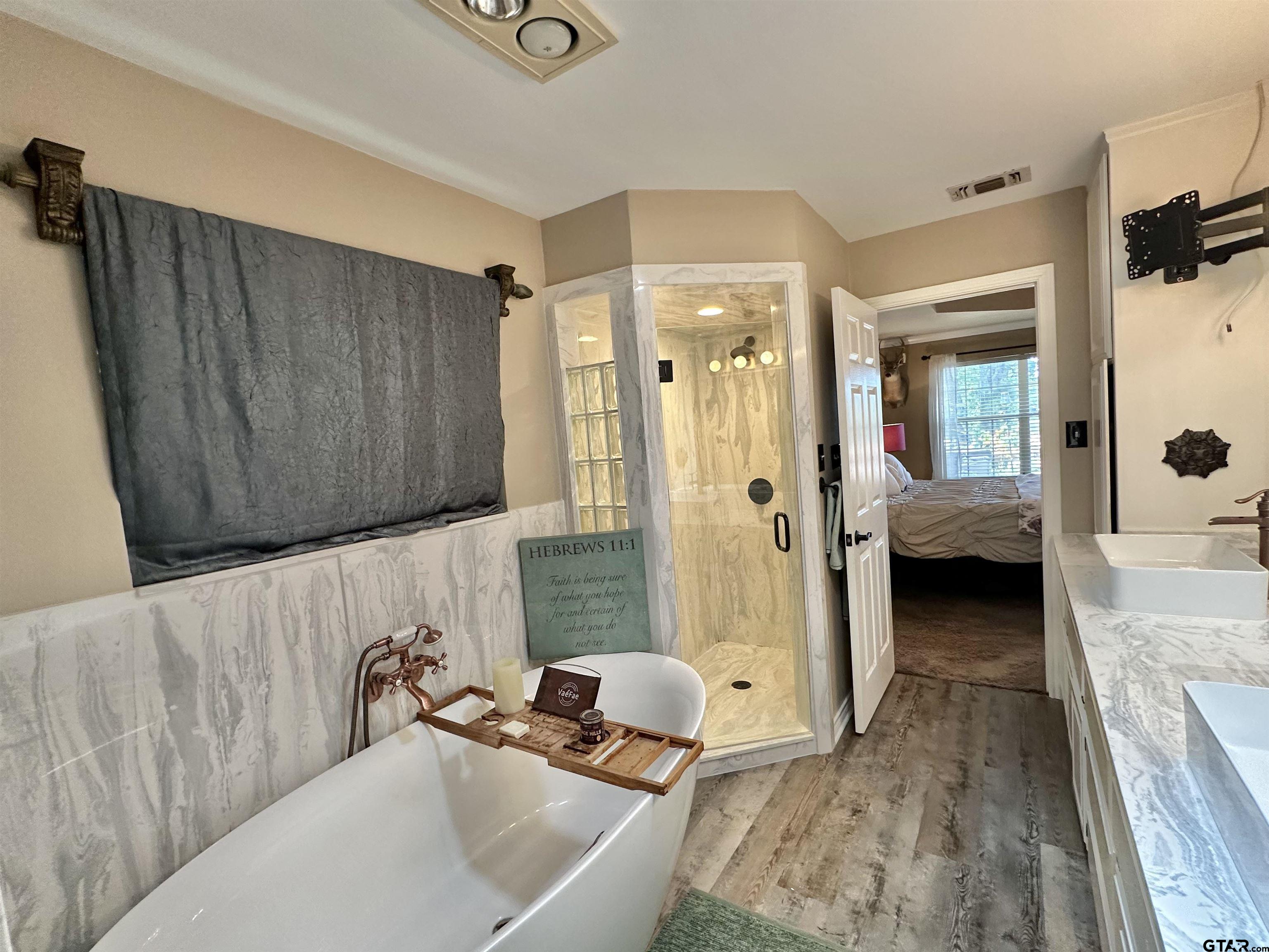 13449 South Hillcreek Road Whitehouse, TX 75791 - Photo 21 of 41 a bathroom with a sink and a tub