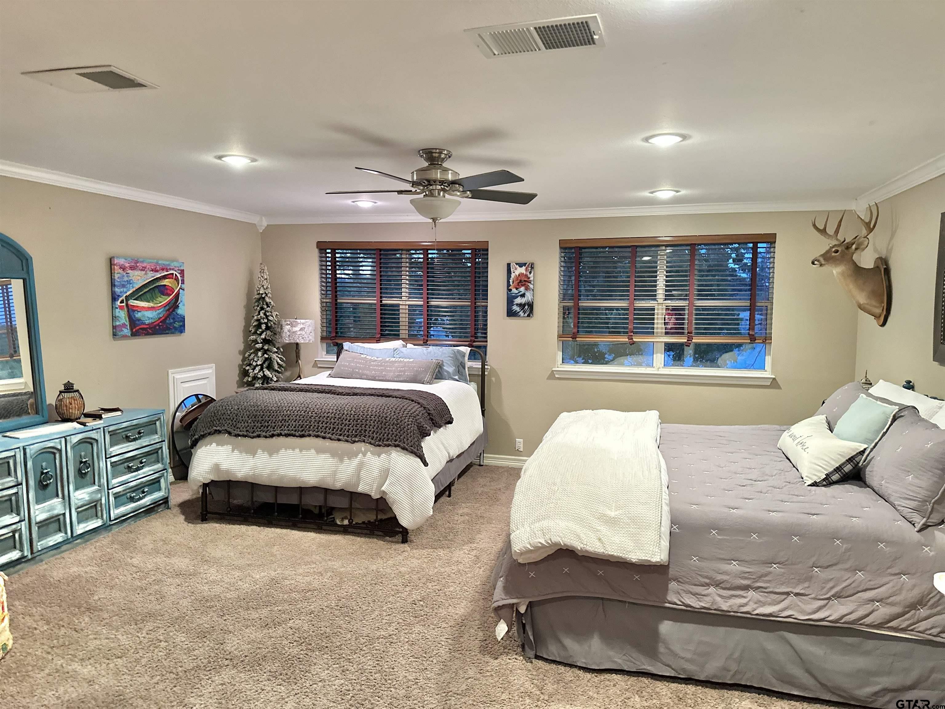 13449 South Hillcreek Road Whitehouse, TX 75791 - Photo 28 of 41 a spacious bedroom with a bed and glass walk in closet