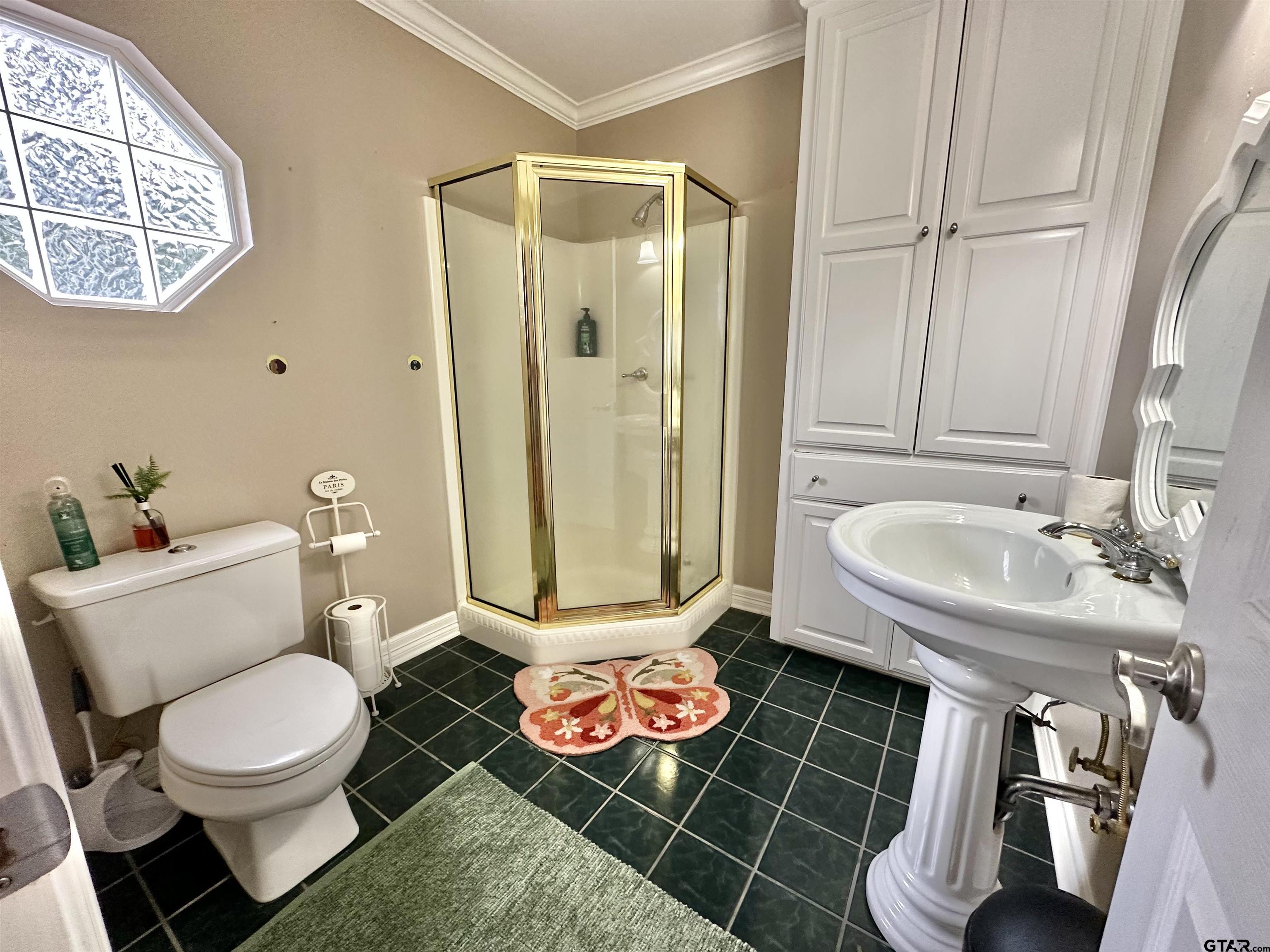 13449 South Hillcreek Road Whitehouse, TX 75791 - Photo 31 of 41 a bathroom with a toilet sink and shower