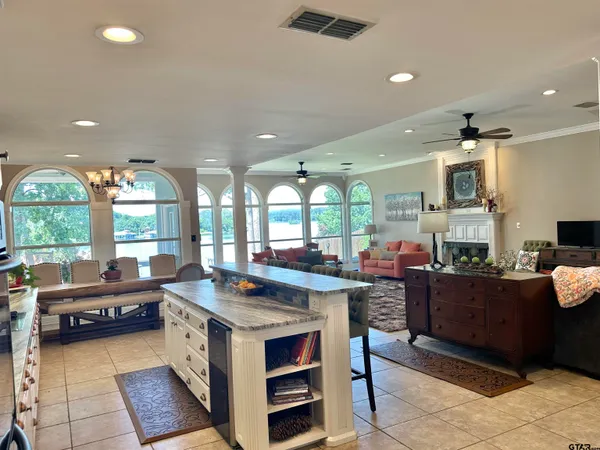 a kitchen with stainless steel appliances granite countertop a sink and cabinets