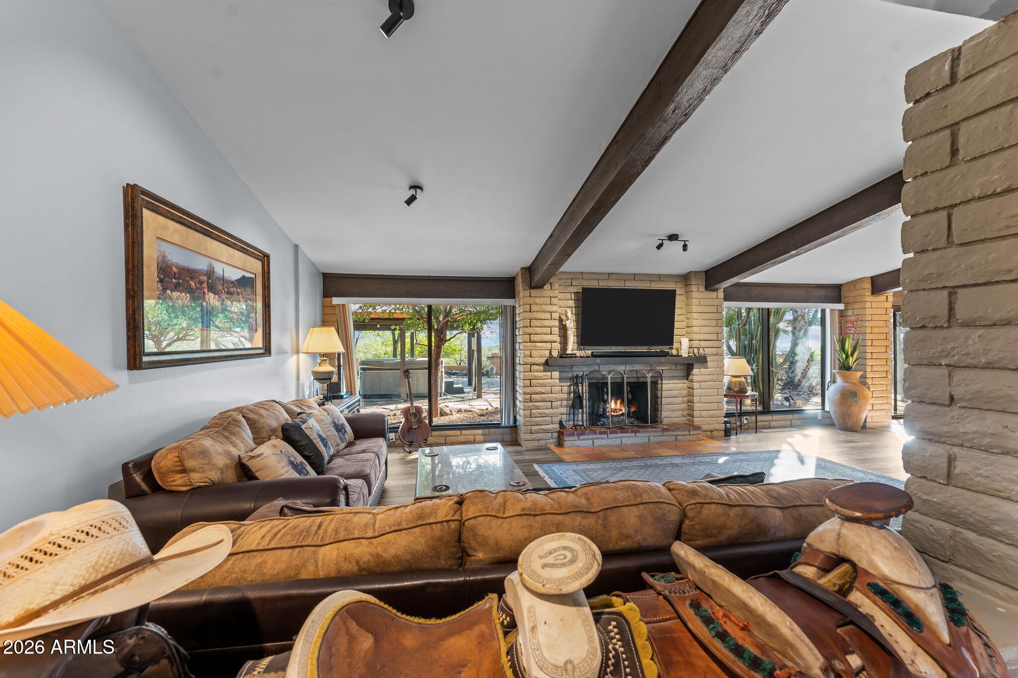 1349 North Forty Road Wickenburg, AZ 85390 - Photo 13 of 49 a living room with furniture and a flat screen tv
