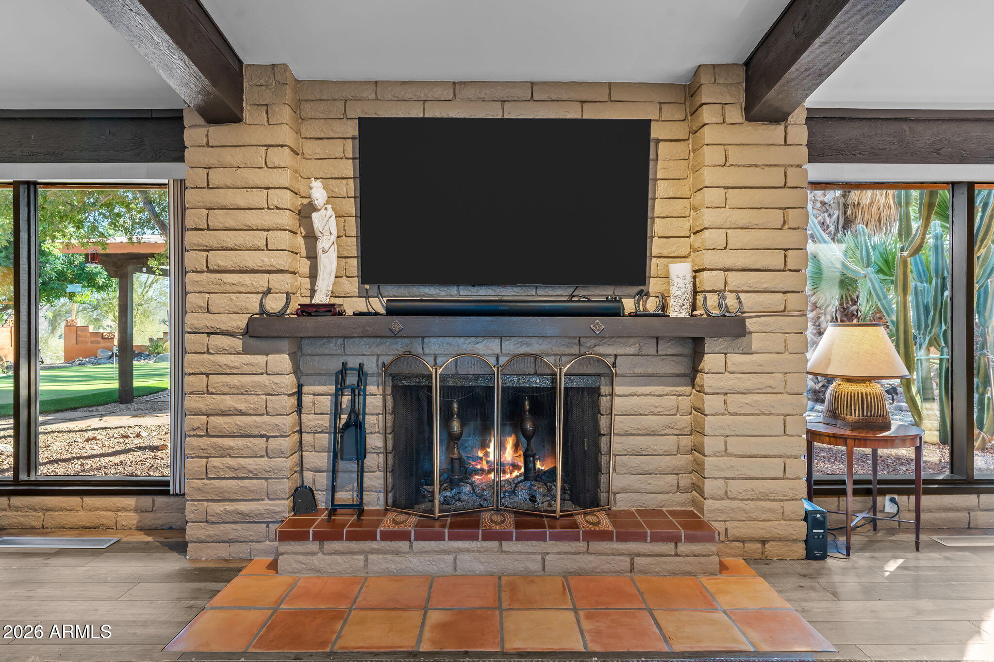 1349 North Forty Road Wickenburg, AZ 85390 - Photo 14 of 49 a living room with fireplace furniture and a flat screen tv