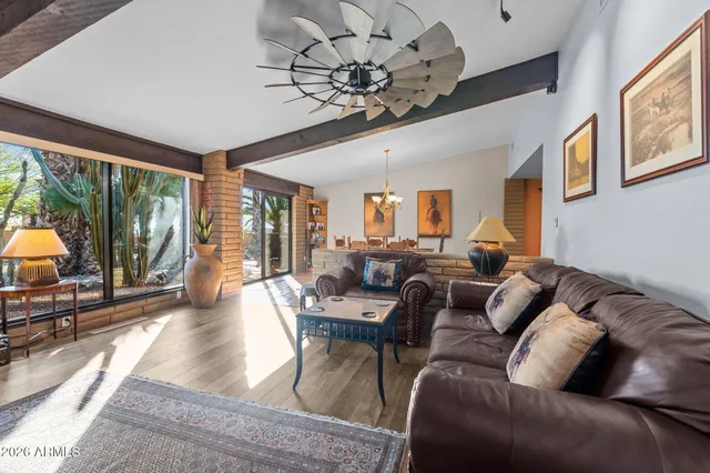 a kitchen with stainless steel appliances kitchen island granite countertop a refrigerator and microwave