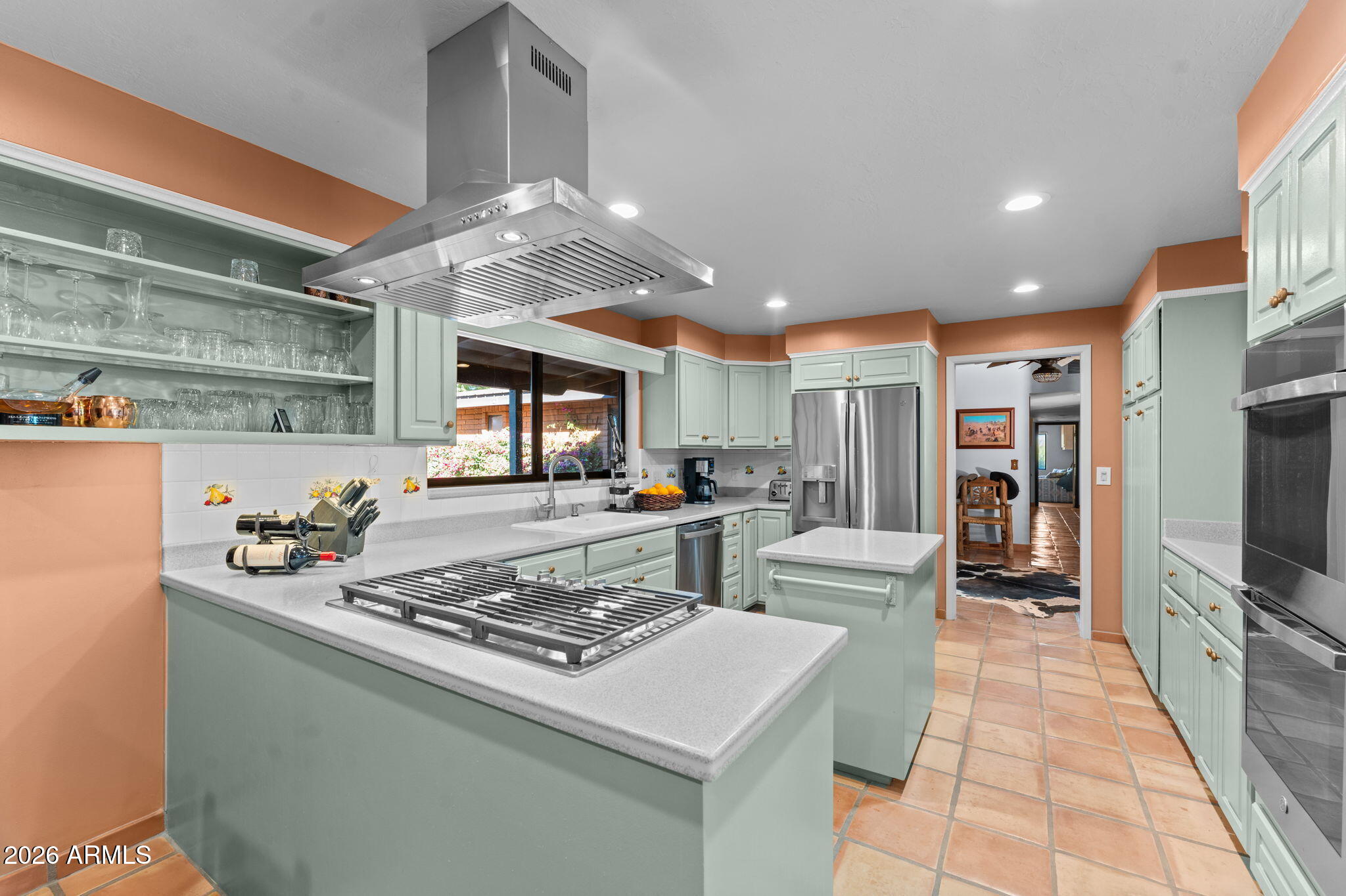 1349 North Forty Road Wickenburg, AZ 85390 - Photo 18 of 49 a kitchen with stainless steel appliances granite countertop a stove oven and a refrigerator with cabinets
