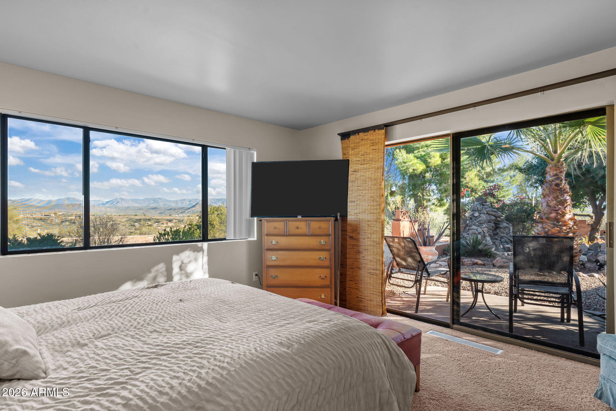 1349 North Forty Road Wickenburg, AZ 85390 - Photo 20 of 49 a bedroom with a bed and large window