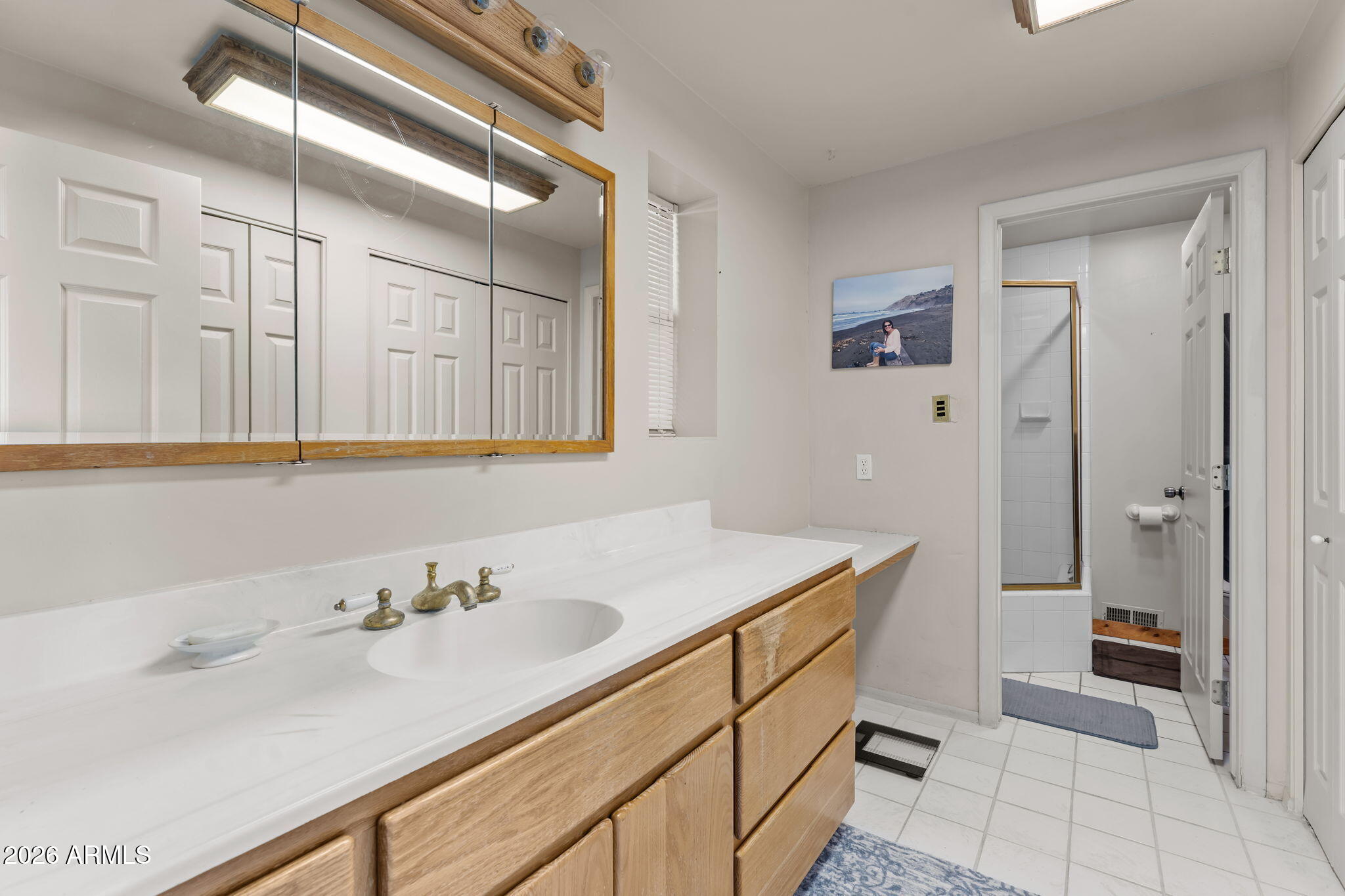 1349 North Forty Road Wickenburg, AZ 85390 - Photo 26 of 49 a bathroom with a sink and a mirror