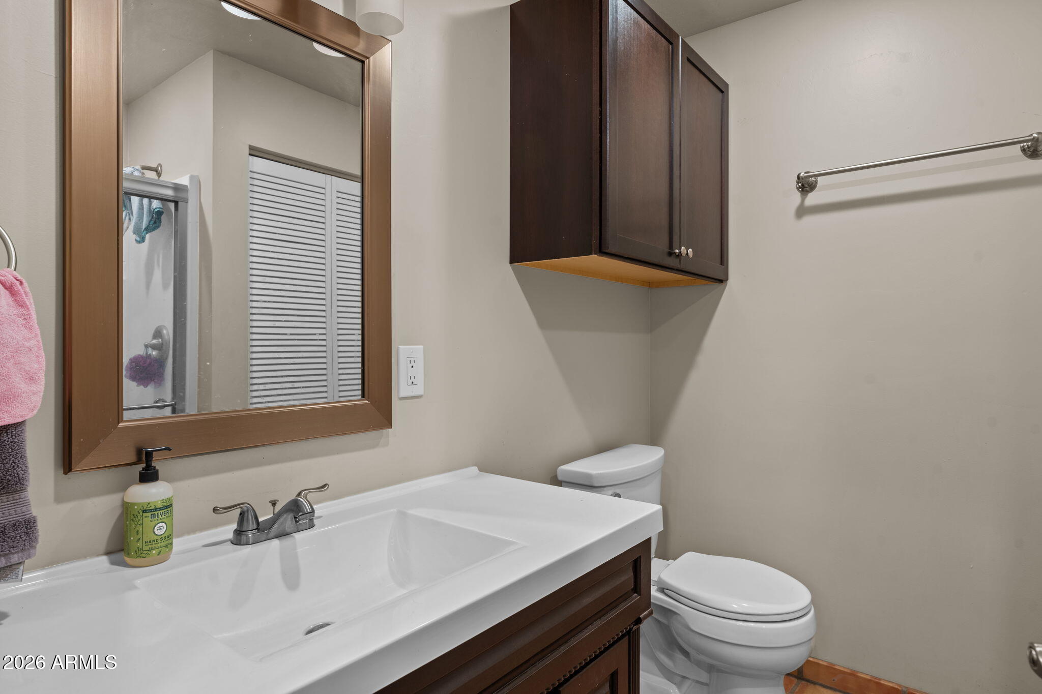 1349 North Forty Road Wickenburg, AZ 85390 - Photo 30 of 49 a bathroom with a sink a toilet and a mirror