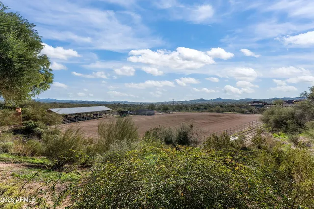 an aerial view of residential house and green space