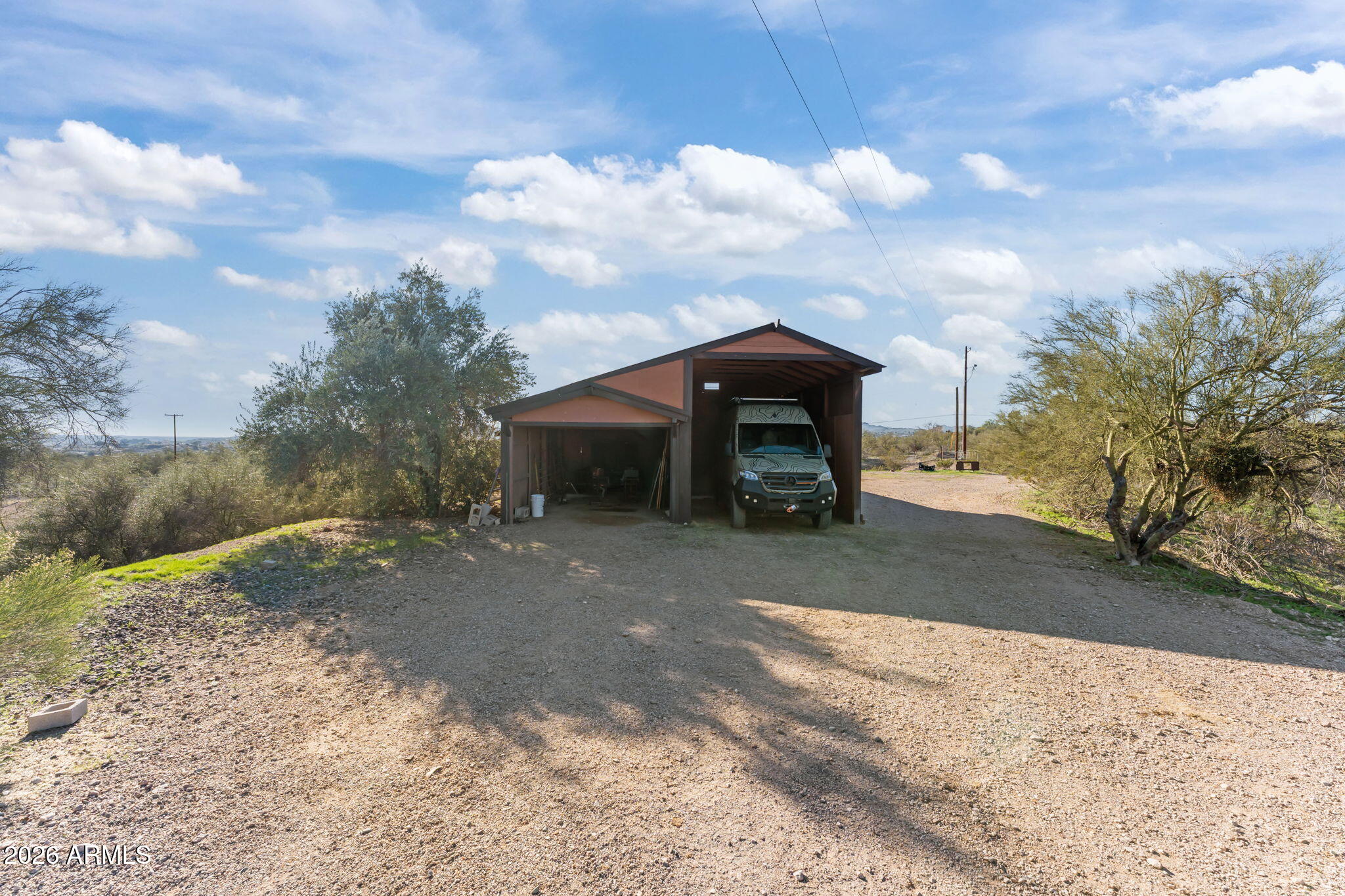 1349 North Forty Road Wickenburg, AZ 85390 - Photo 41 of 49 a view of a house with a yard
