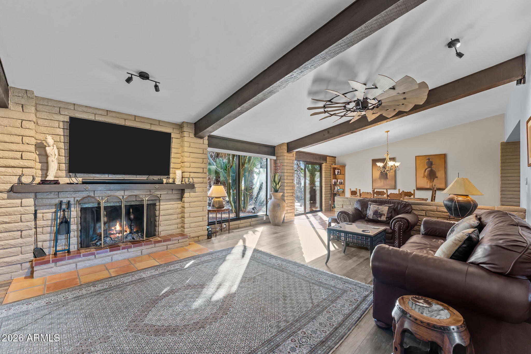 1349 North Forty Road Wickenburg, AZ 85390 - Photo 6 of 49 a living room with fireplace furniture and a flat screen tv
