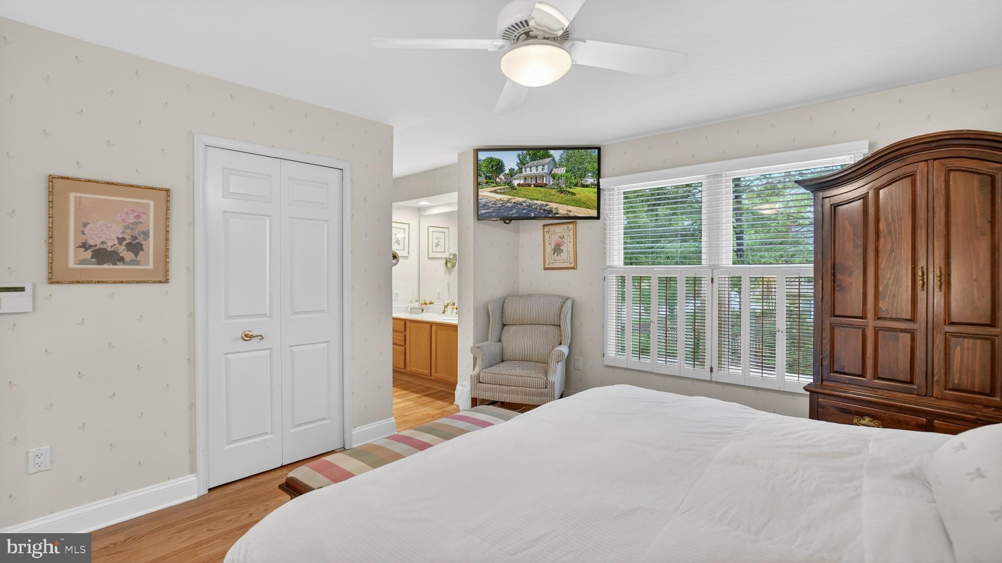 317 Canterfield Road Annapolis, MD 21403 - Photo 28 of 66 a bedroom with a bed and a large mirror next to a window