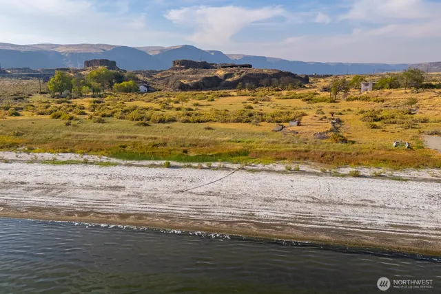 a view of an ocean and a mountain