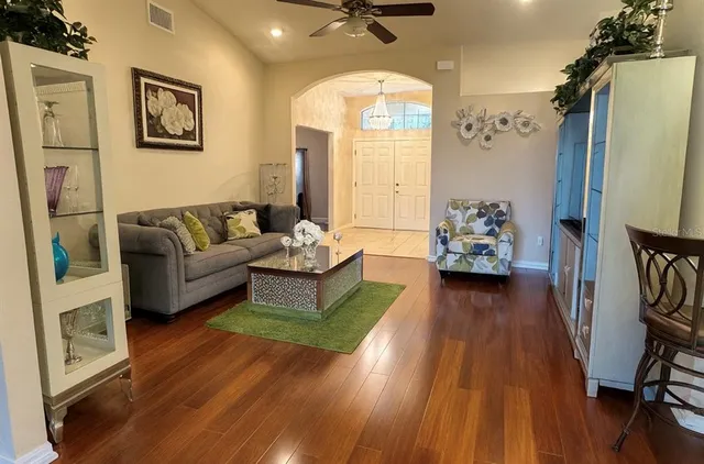 a living room with furniture and a large window