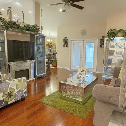 a living room with furniture and a fireplace