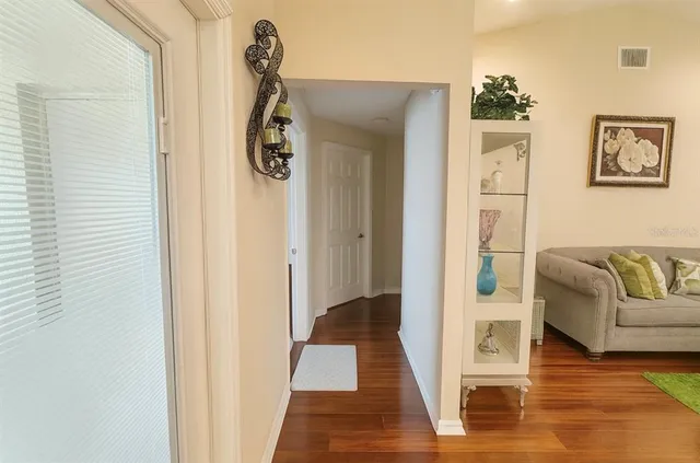 a bathroom with a granite countertop sink a toilet and a shower