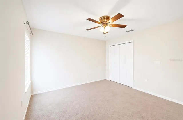 a bedroom with a bed and dresser