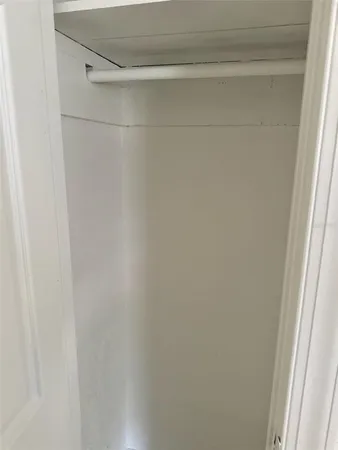 a large kitchen with a stove a sink dishwasher and a refrigerator