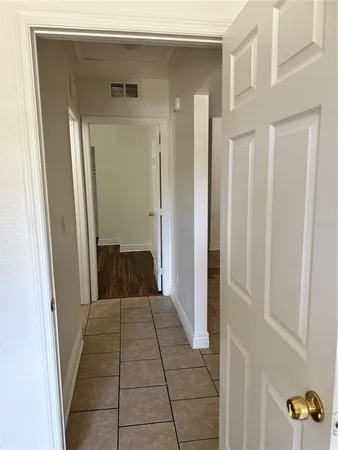 a view of a hallway view with wooden floor and staircase