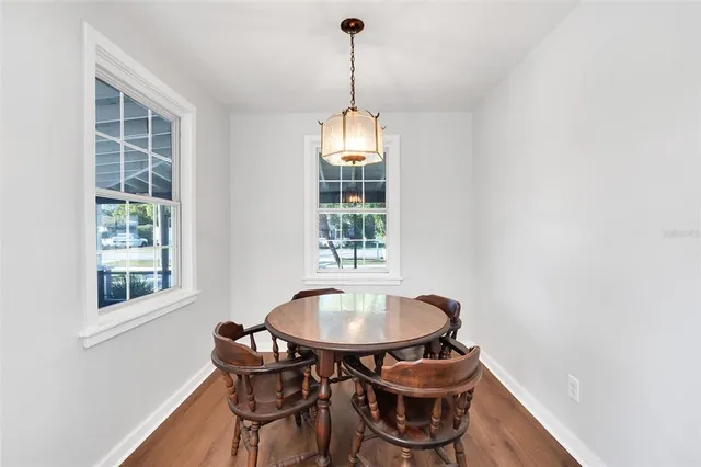a dining room with furniture and window