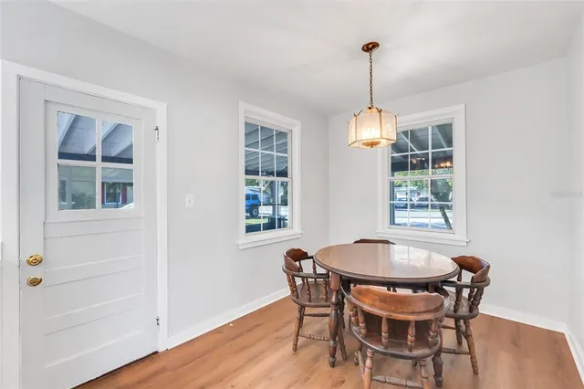 a dining room with furniture and window