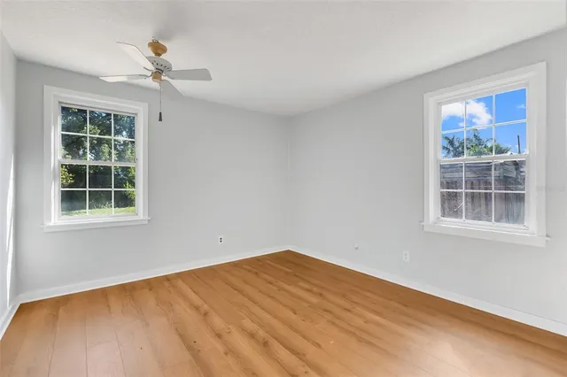 a view of empty room with windows