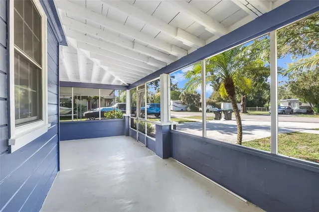 a view of an empty room with a large window