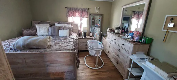 a spacious bathroom with a granite countertop sink and a mirror