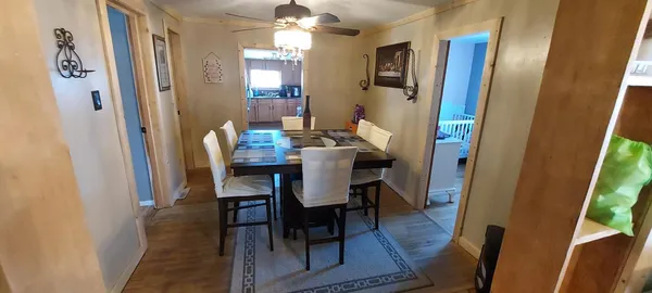 a dining room with furniture and window