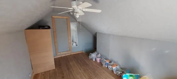 a room with water heater and stairs