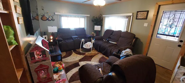 a living room with furniture and a window
