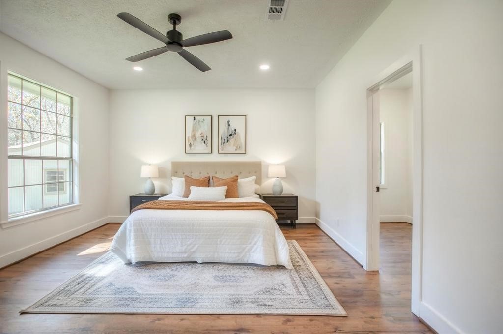 83 Dahlia Road Huntsville, TX 77320 - Photo 20 of 49 a bedroom with a large bed and a window