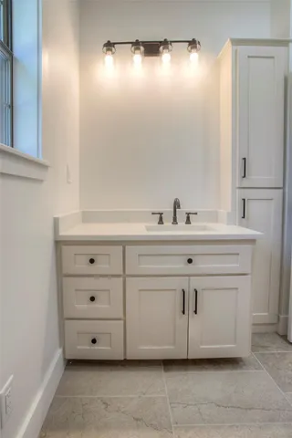 a bathroom with a sink and a mirror