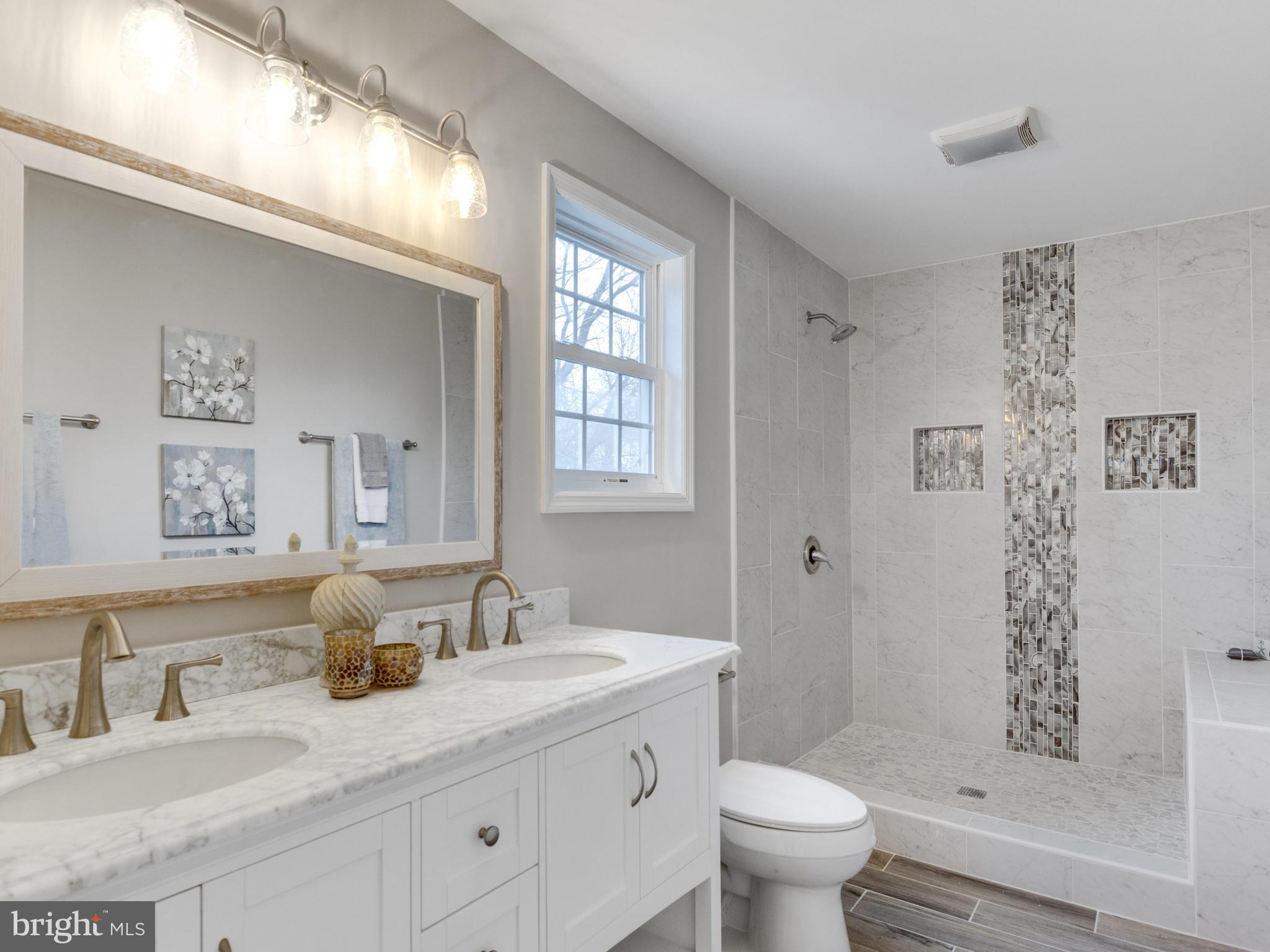 1819 Anderson Road Falls Church, VA 22043 - Photo 15 of 21 a bathroom with a granite countertop sink a toilet and a mirror