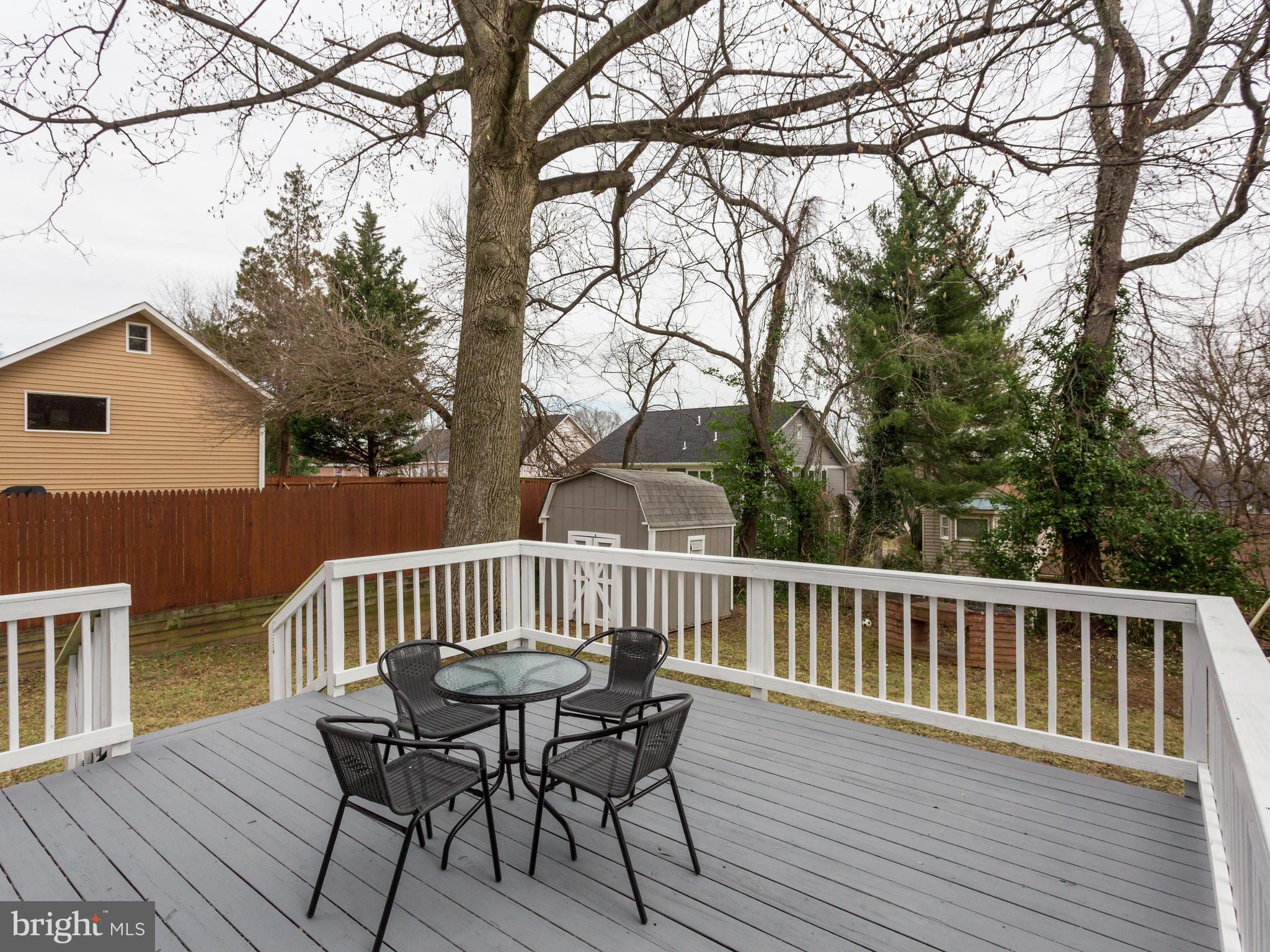 1819 Anderson Road Falls Church, VA 22043 - Photo 18 of 21 a view of a deck with table and chairs and wooden floor