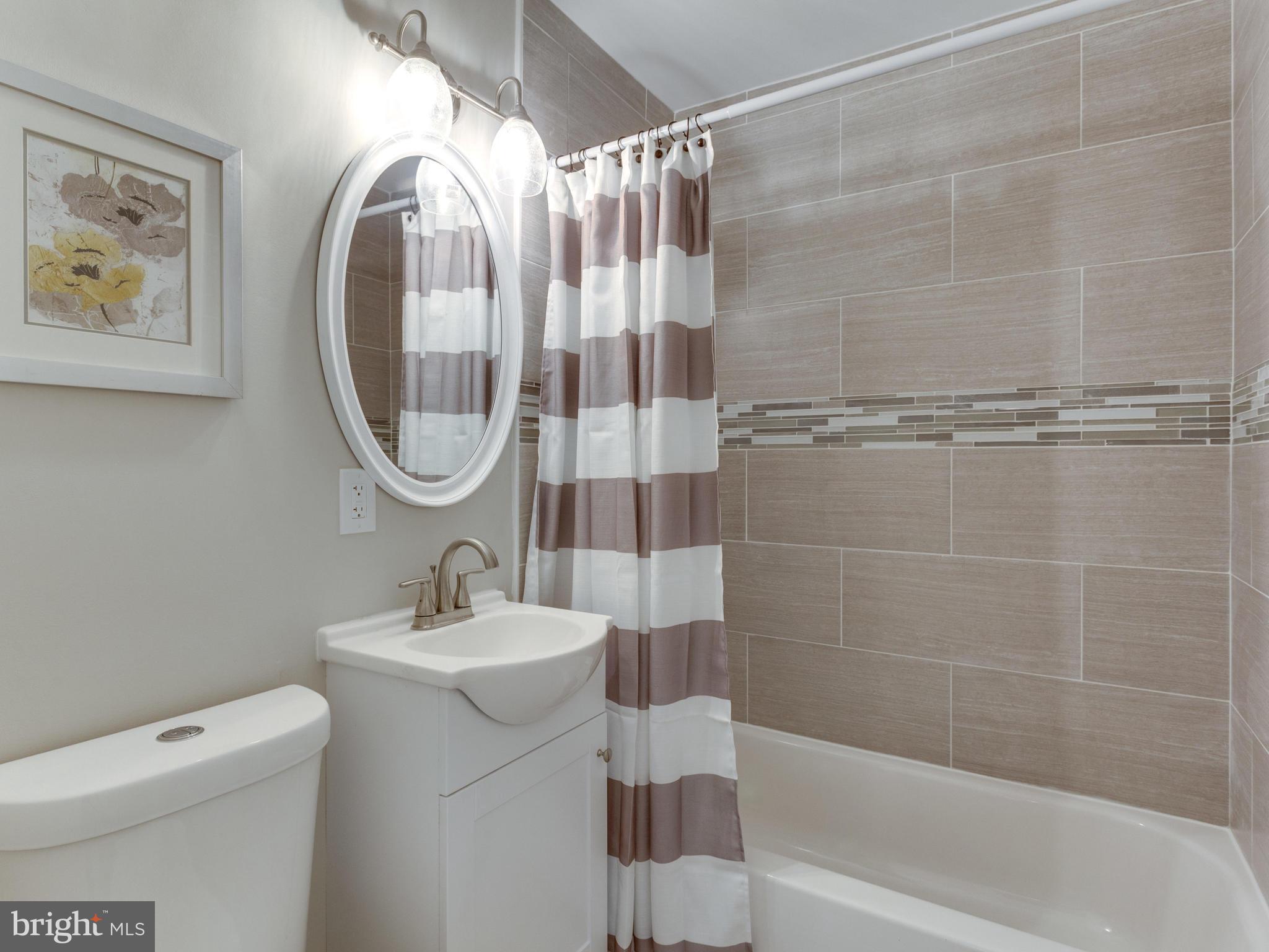 1819 Anderson Road Falls Church, VA 22043 - Photo 4 of 21 a bathroom with a sink a toilet and a shower