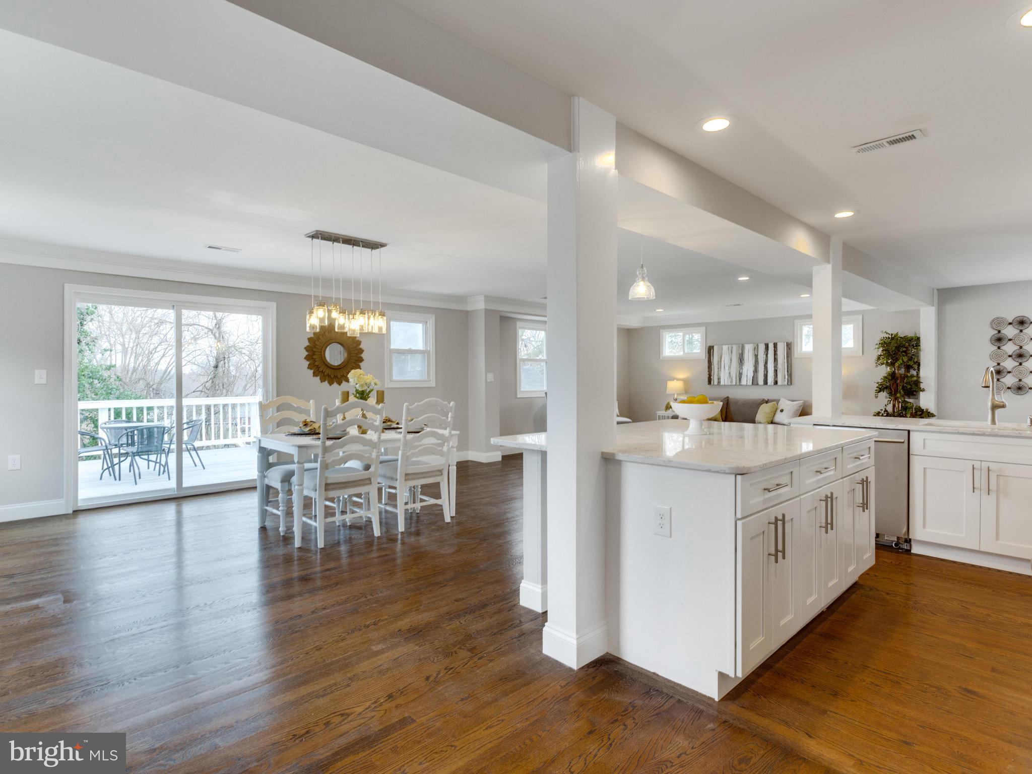 1819 Anderson Road Falls Church, VA 22043 - Photo 20 of 21 a kitchen with stainless steel appliances granite countertop wooden floors and white cabinets