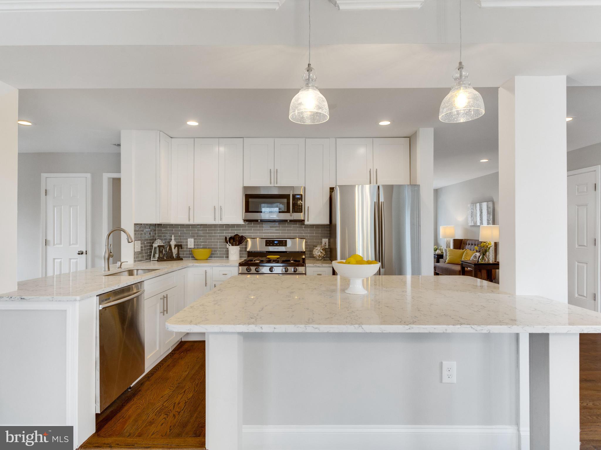 1819 Anderson Road Falls Church, VA 22043 - Photo 6 of 21 a kitchen with stainless steel appliances a stove a sink a refrigerator a center island and couches