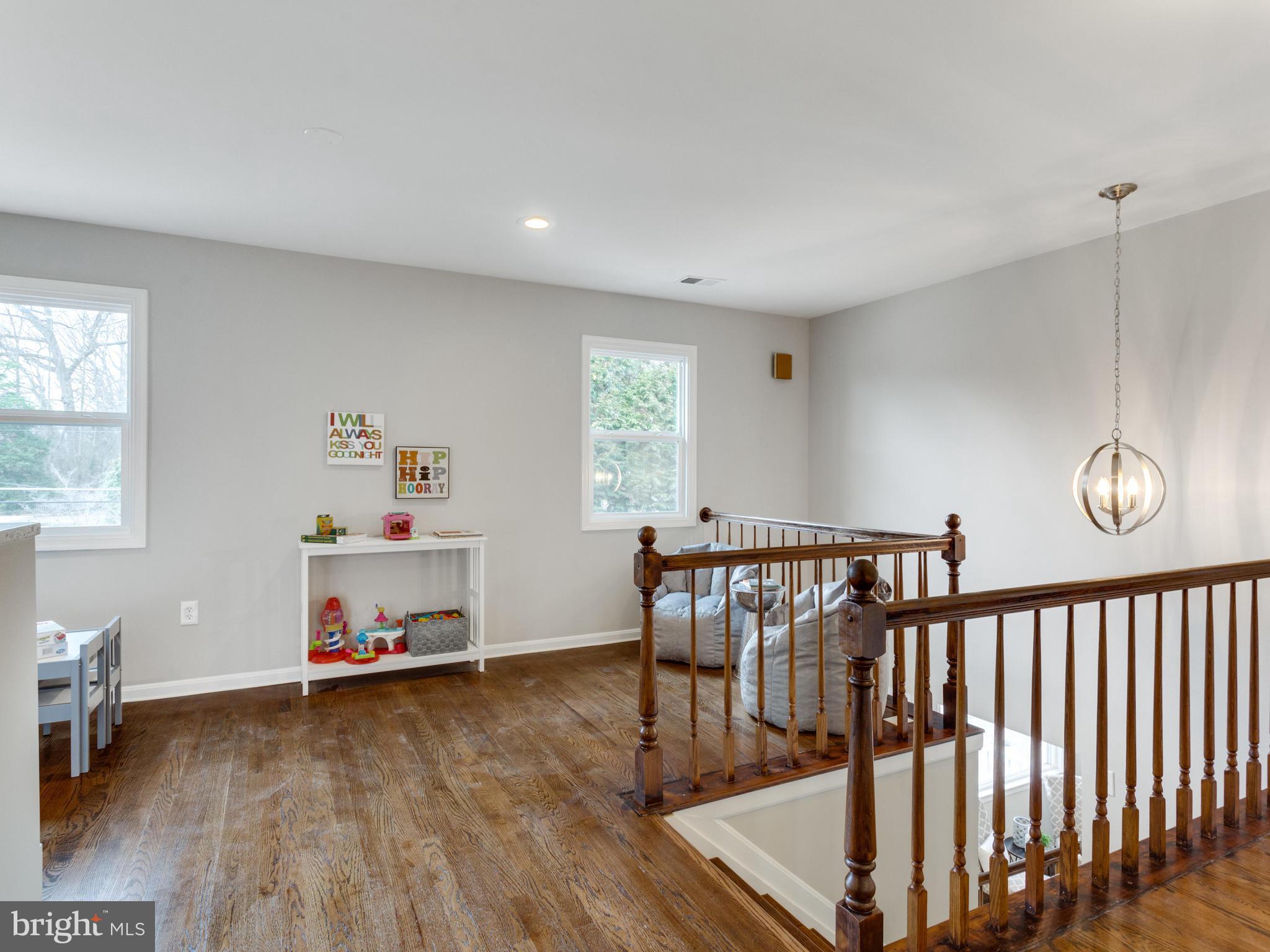1819 Anderson Road Falls Church, VA 22043 - Photo 9 of 21 a hallway with a wooden floor and a dining table