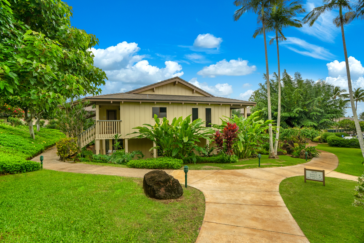 1870 Hoone Road, Unit 602 Koloa, HI 96756 - Photo 22 of 26 a front view of a house with a yard
