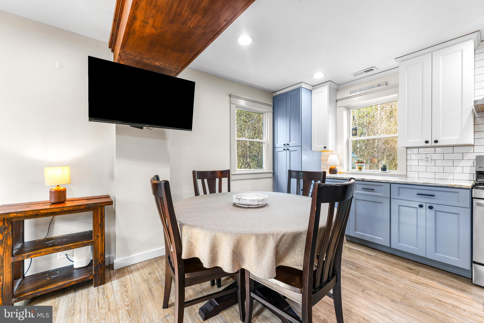 6204 Ebenezer Road Middle River, MD 21220 - Photo 13 of 70 a view of a dining room with furniture window and wooden floor