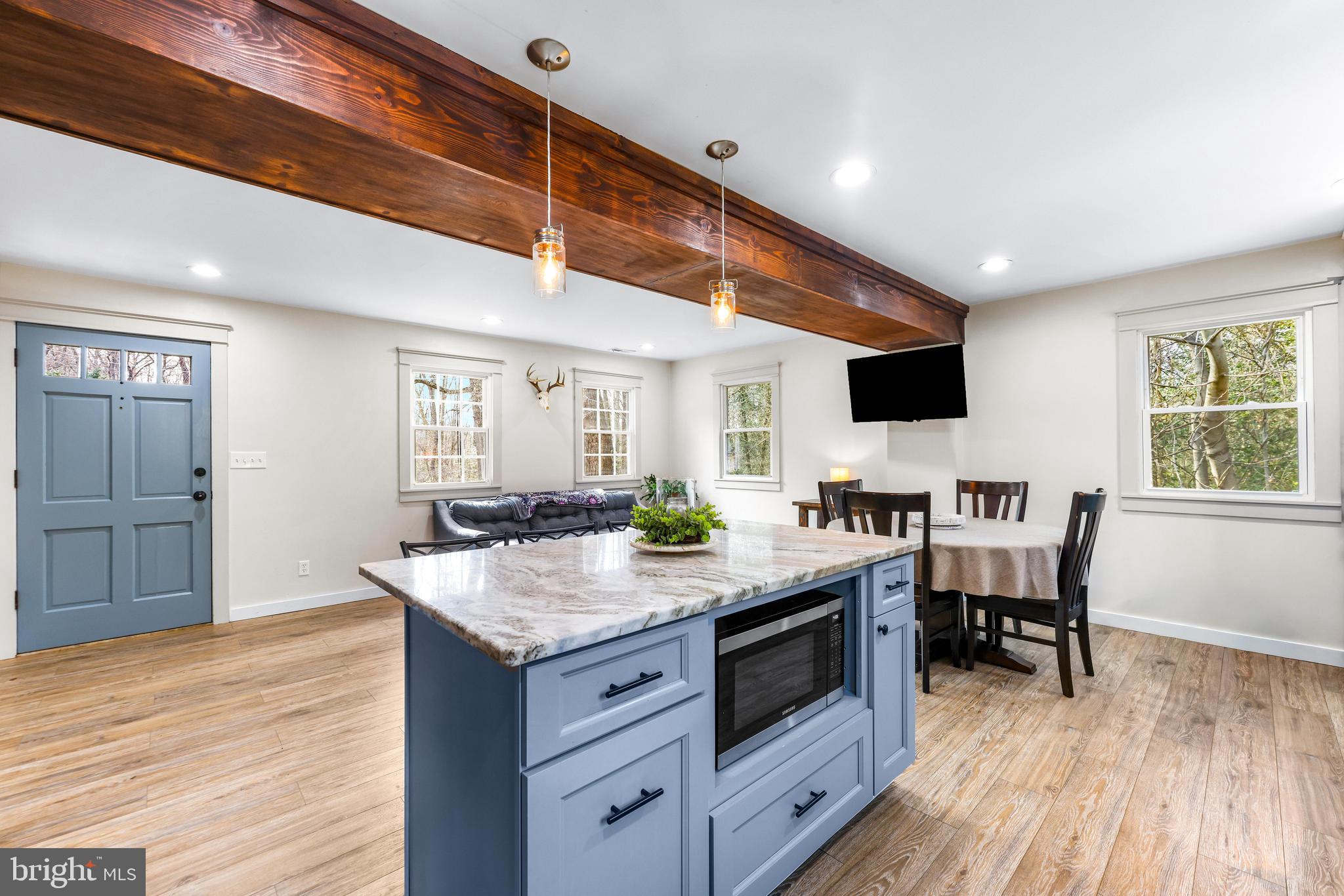 6204 Ebenezer Road Middle River, MD 21220 - Photo 16 of 70 a kitchen with a stove and a wooden floors