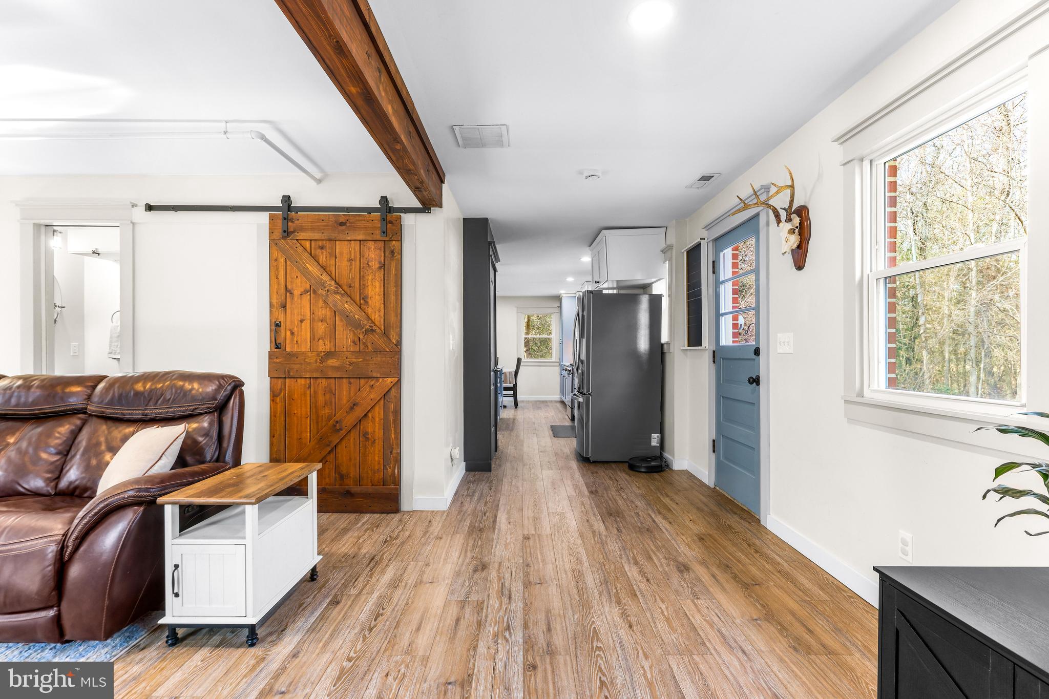 6204 Ebenezer Road Middle River, MD 21220 - Photo 28 of 70 a view of a living room with furniture and large windows