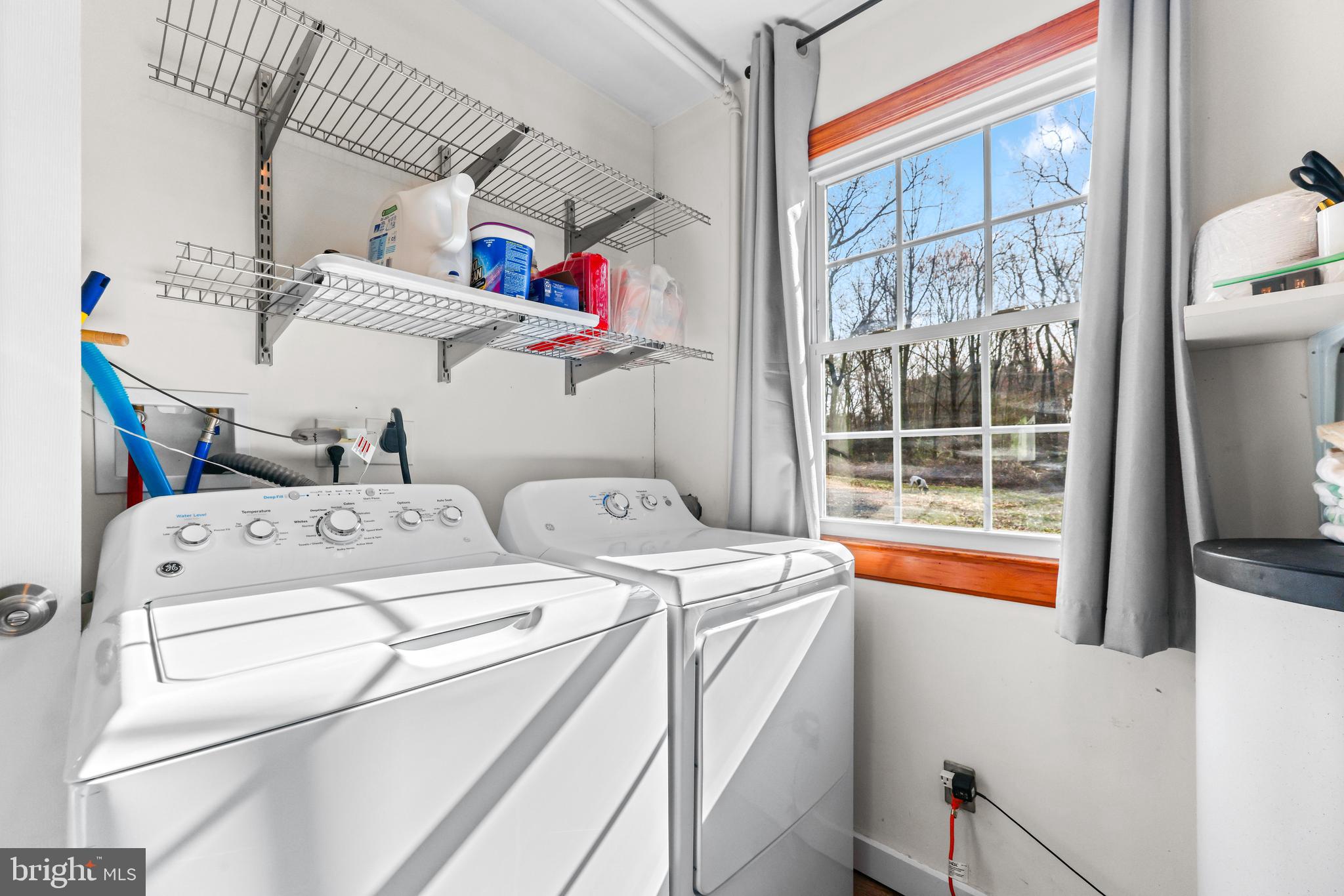 6204 Ebenezer Road Middle River, MD 21220 - Photo 30 of 70 a utility room with dryer and washer
